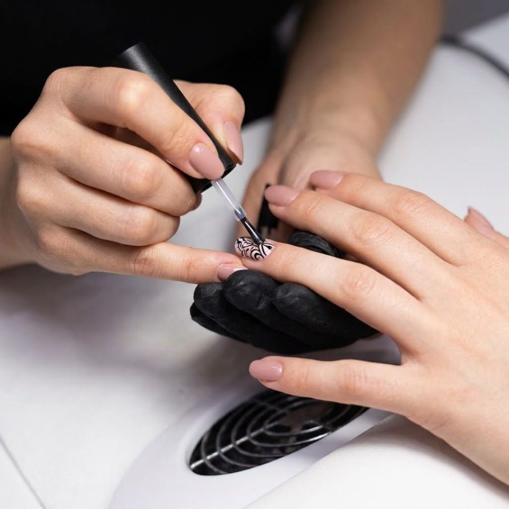 A woman getting a manicure.